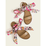 Shein- A sandal with a decorative back strap, with a scarf