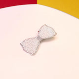 RIVERS BRAND- PEARL AND DIAMANTES DECORATED BOW ALLIGATOR HAIR CLIP